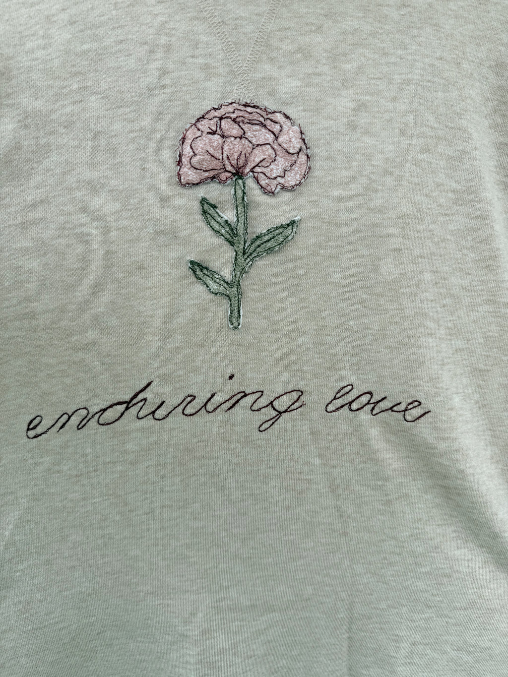 “enduring love” patchwork crewneck